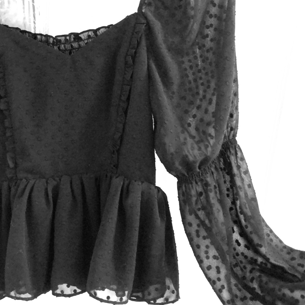 Black peplum sweetheart top with sheer sleeves